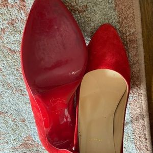 Christian Louboutin red pumps